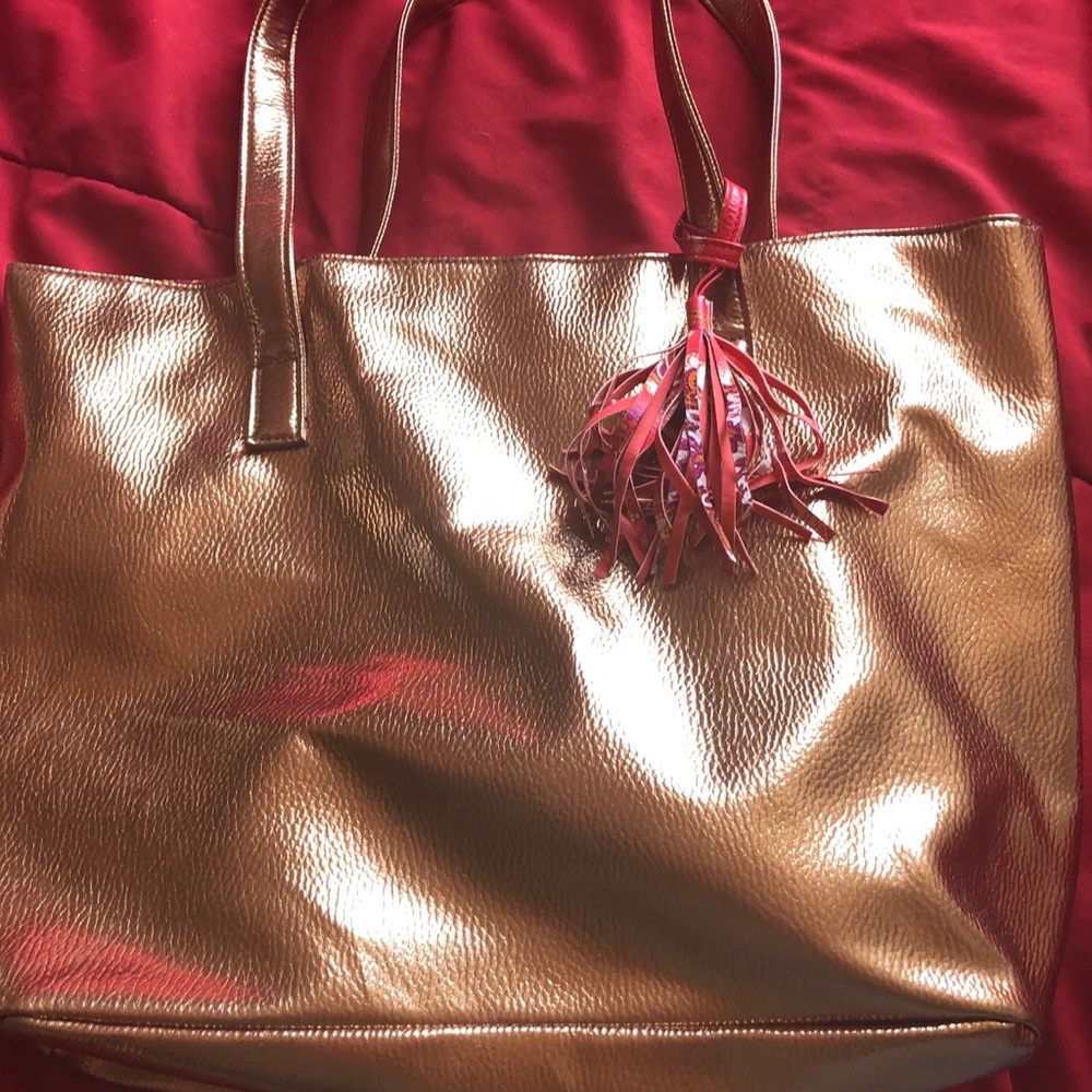 Gold purse with colored tassel